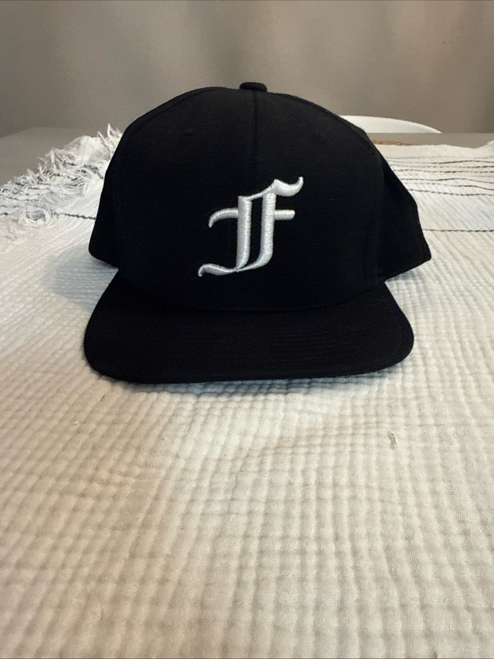 The Classic Black Cap with Gold Embroidered Label